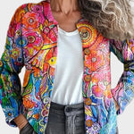 Ingeborg – bunte Strickjacke mit malerischem Druck aus Blüten und Vögeln in Rosa, Orange und Blau – Elara München