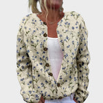 Konstanze – Strickjacke in Creme mit feinen Blüten