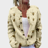 Brigitta – Strickjacke in Creme mit zarten Blüten