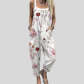 Weiße Latzhose mit roten Blüten