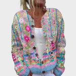 Traudel – Strickjacke in Creme mit bunten Blüten