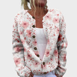 Sylvia – Strickjacke mit roten Blüten auf Weiß
