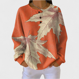 Manon - Oranger Pullover mit Herbstblatt-Motiv