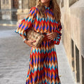 Cassandra - Vibrante Geometrische Kleid
