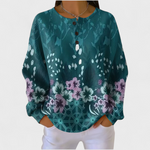 Nora – petrolfarbener Pullover mit floralem Design